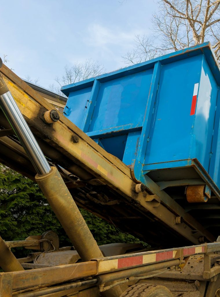 Unloading empty dumpster